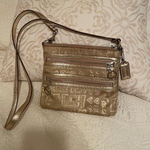 Gold coach poppy purse